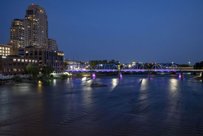 Illuminated buildings at waterfront