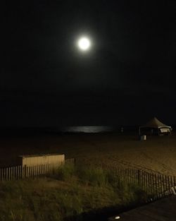Scenic view of lake against sky at night