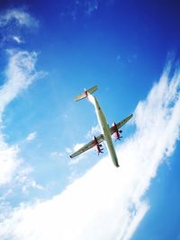 Low angle view of airplane flying in sky