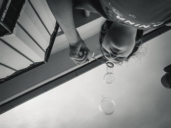 Low section of people standing on glass