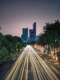 High angle view of light trails on road at night