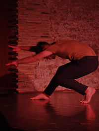 Man dancing in darkroom