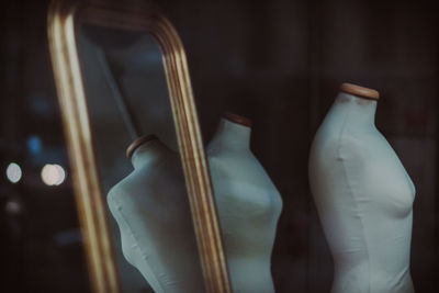 Low section of woman standing by window