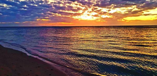 Scenic view of sea against sky during sunset