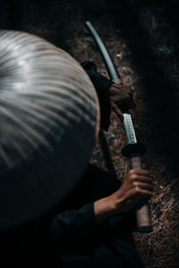 High angle view of man holding umbrella