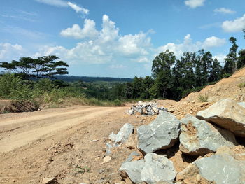 View of rocks on land against sky