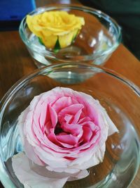 High angle view of roses in glass on table