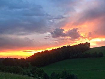 Scenic view of dramatic sky during sunset