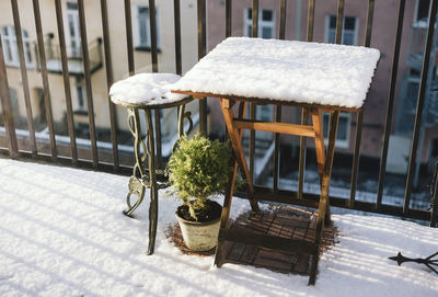 Chairs and table in yard during winter
