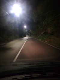 Road against sky at night