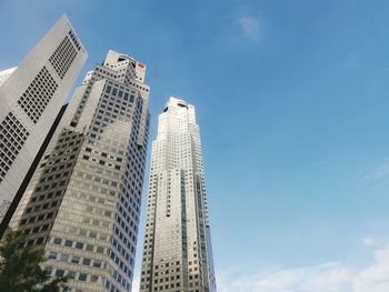 Low angle view of modern buildings against sky