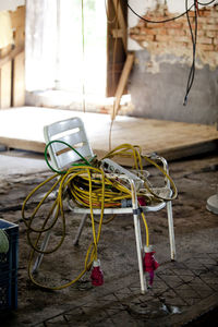 High angle view of chair with cable outdoors