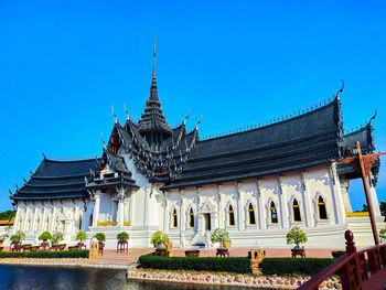 Temple building against clear blue sky