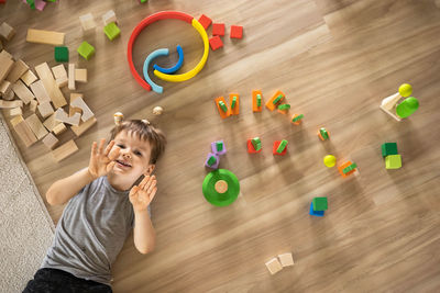 High angle view of girl playing with toys on table