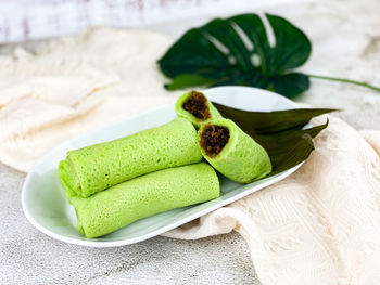 Close-up of green fruits on table