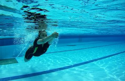 Man swimming in pool