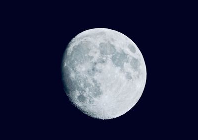 Low angle view of moon against sky at night