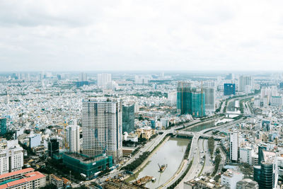 High angle view of modern buildings in city against sky