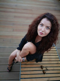 Portrait of young woman on staircase