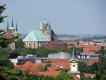 Houses in town against sky