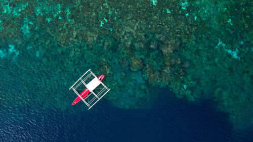 High angle view of flag in sea