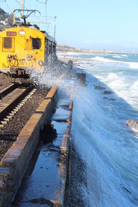 Train on railroad track against sky