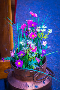 Close-up of purple flower pot on potted plant