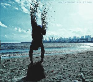 Man on beach against sky