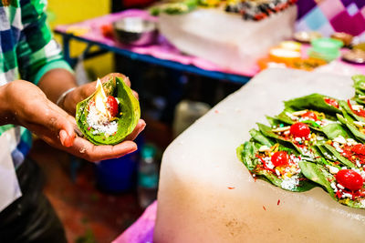 Close-up of woman holding fruit