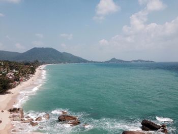 Scenic view of sea against cloudy sky