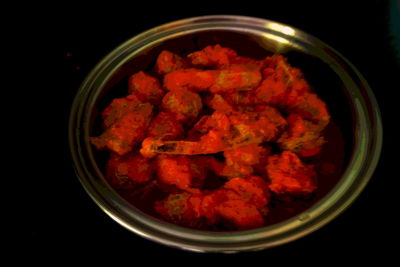 Close-up of red meat against black background