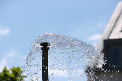 Close-up of water splashing from agricultural sprinkler