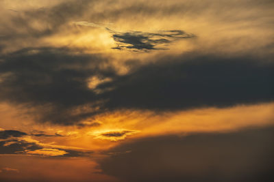 Low angle view of dramatic sky during sunset