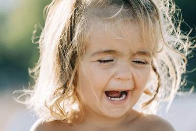 Close-up portrait of smiling girl