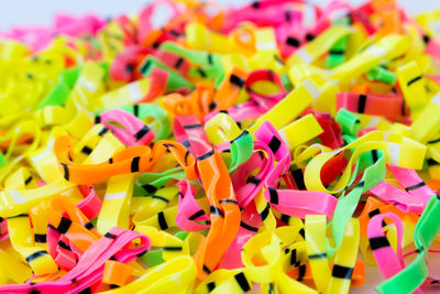 Close-up of multi colored rubber bands on table