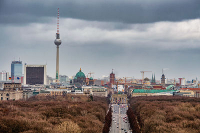 View of buildings against cloudy sky