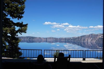 View of lake against blue sky