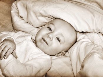 Close-up of baby sleeping on bed