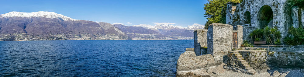 Extra wide view of the lake of como from the beach of corenno