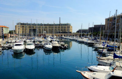 Boats moored at harbor