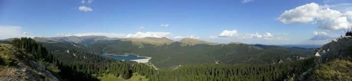 Scenic view of landscape against cloudy sky