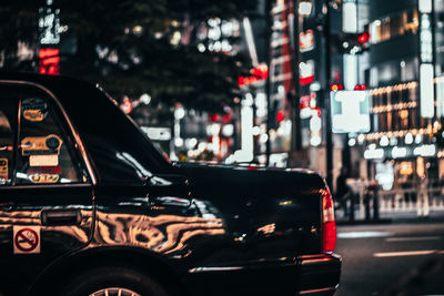 Cars on street in city at night