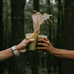 Close-up of hand holding drink