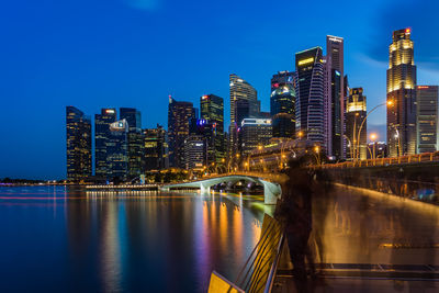 Illuminated city at waterfront