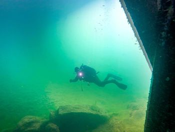 Full length of man swimming undersea