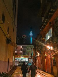 Illuminated buildings in city at night