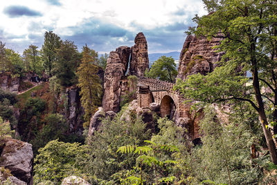 Low angle view of arch bridge against sky