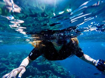 Woman swimming in sea