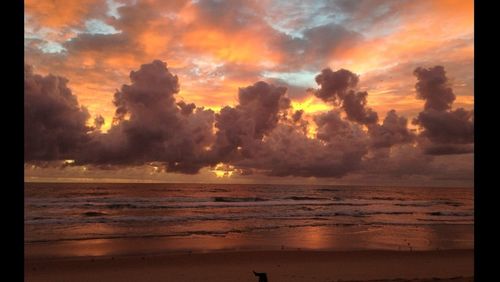 Scenic view of sea against cloudy sky