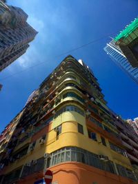 Low angle view of building against blue sky